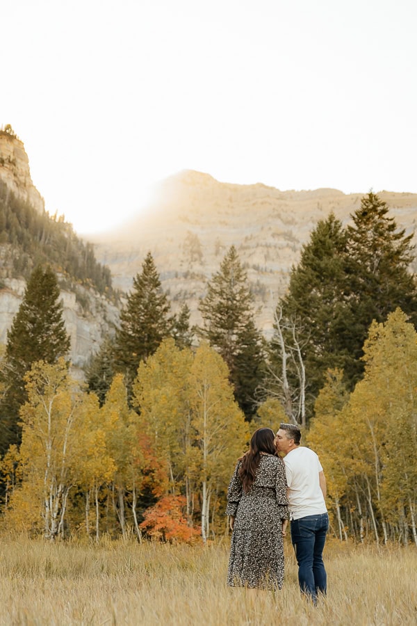 Couple kissing in the Utah mountains for mountain engagement photos.